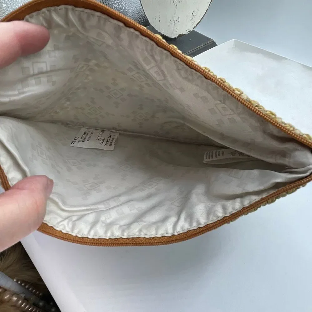 Jewel Thirty-one woven clutch or makeup bag